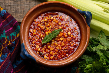 Red corn esquites on wooden background. Mexican food