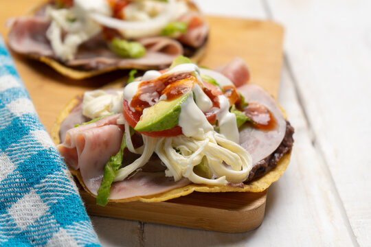 Corn Toast With Ham And Oaxaca Cheese On White Background. Mexican Food