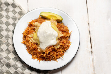 Dry fideo with cheese and sour cream on white background