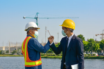 Two people Engineer teamwork outdoor working on site construction