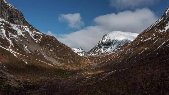 Aerial drone push in timelapse of mountain valley in western Norway skorgedalen sunnmore Orsta.