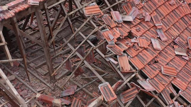 Beirut, Lebanon, 2020: day drone shot top view of destroyed tiles on the rooftop of house due to the 4 August explosion
