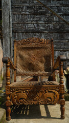 Old wooden chairs with woven rattan backs. Focus selected