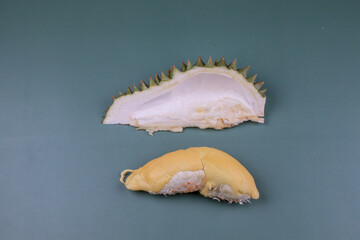 Durian. Durian peel with yellow color on green pastel background. King of fruit from Thailand on summer season