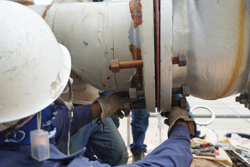 Pipeline system during installation by the construction workers in the industrial plants.