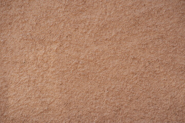 Fototapeta premium Rugged concrete texture. Apricot color. Background for designs