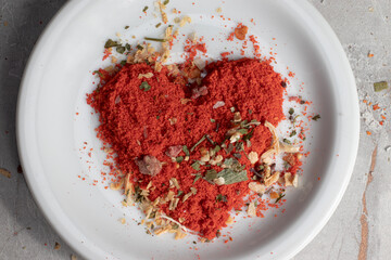 Heart of spices or seasonings on plate. Love cuisine concept