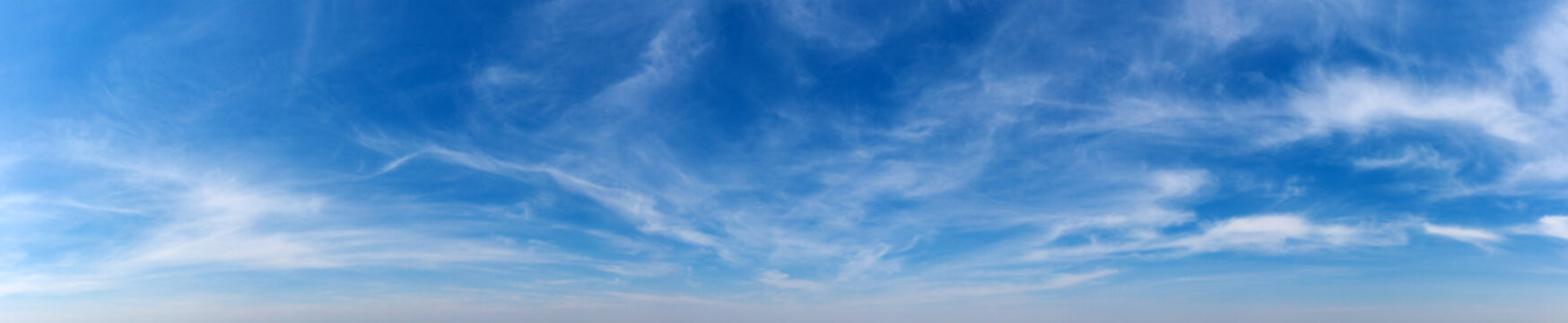 Blue Sky background with tiny Clouds. Panorama background
