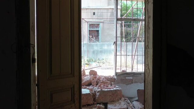 Beirut, Lebanon, 2020: day drone shot track back of the inside and of a destroyed house due to the 4 August explosion