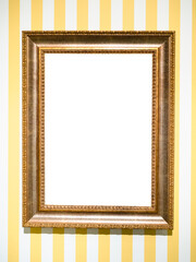 wide golden picture frame on striped yellow wall