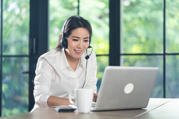 Asian businesswoman working at home, making video call conference.