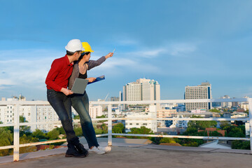 Asian contractors looking away and making notes