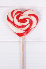Sweet lollipop in shape of heart as surprise for birthday, valentine or different occasions