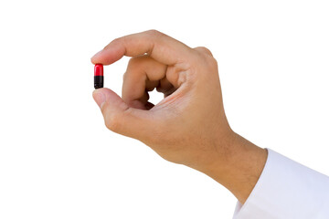Fototapeta premium A man hold a pill or capsule between thumb and forefinger on white background
