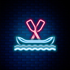 Glowing neon line Rafting boat icon isolated on brick wall background. Kayak with paddles. Water sports, extreme sports, holiday, vacation, team building. Colorful outline concept. Vector