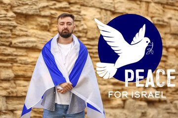 Man with the flag of Israel near the Wailing Wall