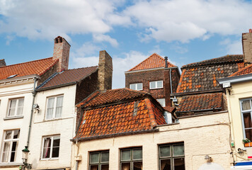 Houses with red tiled roofs in town Bruges, Belgium