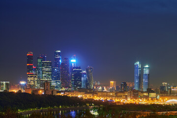 Fototapeta na wymiar Night urban landscape panorama of Moscow with Moscow-city downtown business center with tall buildings. Cityscape of illuminated city. Moscow. Russia.