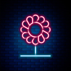 Glowing neon line Flower icon isolated on brick wall background. Colorful outline concept. Vector