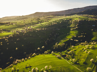 Spring landscape in Slovakia. Polana region, Hrinova. Green spring rural hills landscape, fields, flowering trees, organic farming © Zedspider