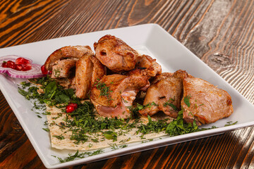 Grilled chicken barbecue served herbs