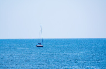 Obraz premium Sailing yacht in the blue calm sea.