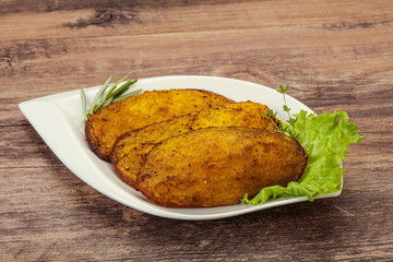 Baked potato with herbs and spices