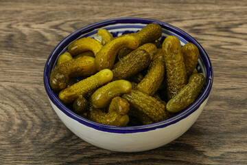Pickled gherkin in the bowl