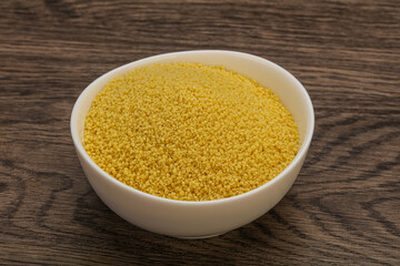 Raw cous cous heap in the bowl