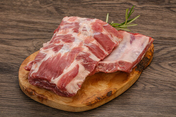 Raw pork ribs served rosemary