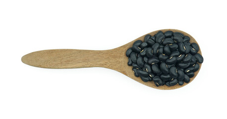 Black beans raw in wooden spoon, Organic grains food, Isolated on white background, Top view