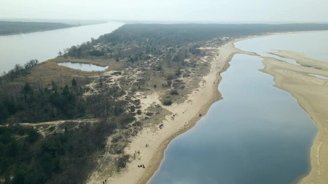 Panoramic View Of Mewia Lacha With People On Dune Seashore In Sobieszewo Island, Bay Of Gdansk, Baltic Sea, Poland. - Aerial Pullback Shot