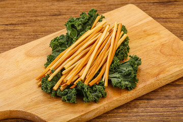 Chechel cheese sticks over board