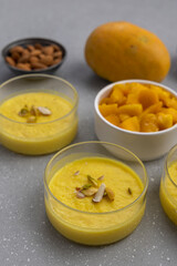 Naklejka na ściany i meble mango-flavored Phirni served in glass bowls