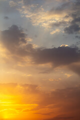 Fototapeta na wymiar Golden sky with clouds at sunset