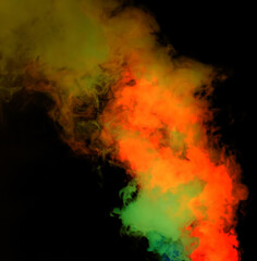 Red and green smoke on a black background.