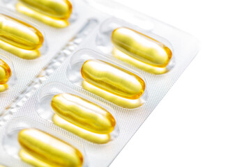 Yellow transparent pills of fish oil