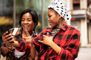 Portrait of a happy smiling female friends. Women laughing and having fun outdoors.