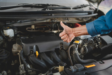 Fototapeta na wymiar Hand of auto mechanic with a wrench. Car repair