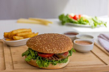 Macdonalds style burger with French fries and special home-made sauces