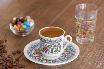 Turkish Coffee is the most famous drink of the Turkey culture internationally in my view and it's served by cold water and some Turkish delight or dried fruits or maybe some piece of chocolate sometim