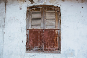 Old wooden windows on white wall