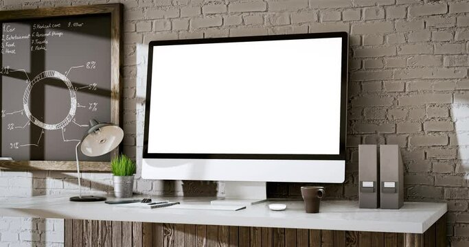 Computer all-in-one with a blank screen in vintage loft office interior - smooth camera movement from right to left with a little zoom