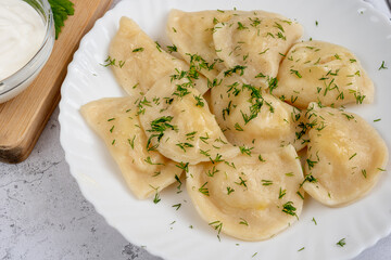 Dumplings with potatoes with dill. Varenyky, vareniki, pierogi, pyrohy.