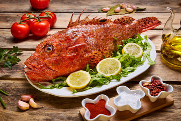 red fish on a background of green lettuce