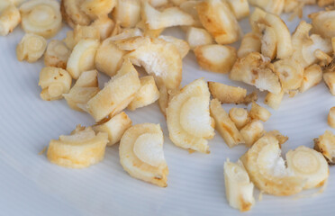 Chopped parsley roots in a plate close up