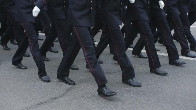 Close-up of the legs of the military, who march on the parade