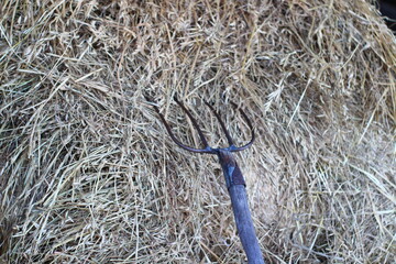Pitchfork and hay bale