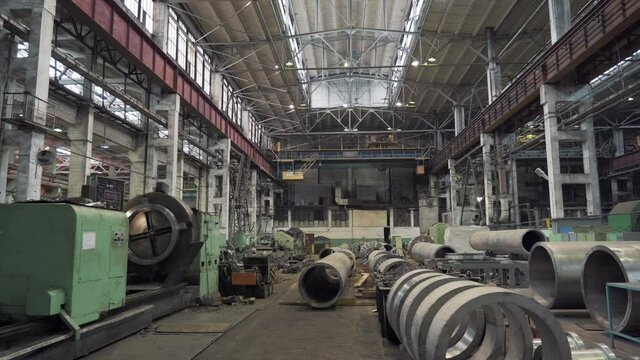 Pipe factory production line industrial warehouse interior, metalwork heavy industry.