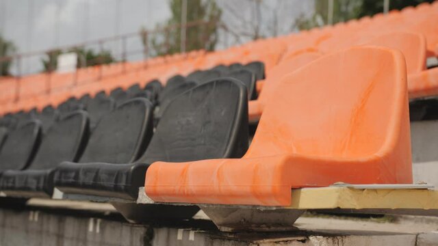 Empty chairs at a sports stadium waiting for the end of the lockout during the coronavirus pandemic.